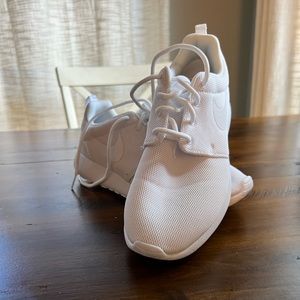 Solid white Nike sneakers